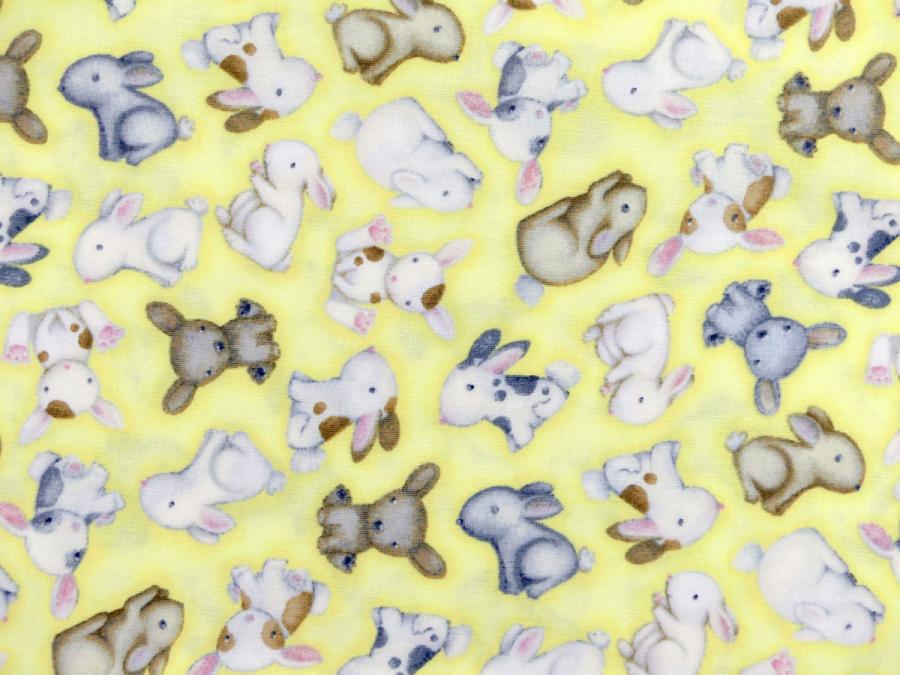 Preview: Patchworkstoff mit Hasenbabies auf gelben Untergrund